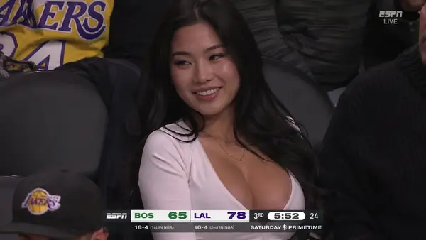 A screenshot from a live NBA game TV broadcast on ESPN. The camera cuts to the… — GPT Image 2 prompt by @johnAGI168