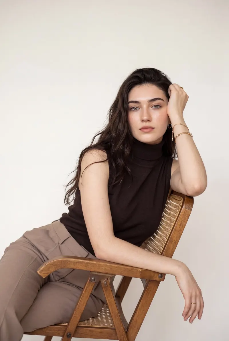Ultra-realistic luxury fashion editorial portrait of a woman leaning sideways… — Nano Banana Pro prompt by @ZaraIrahh