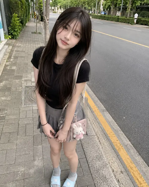Young Japanese girl with long straight dark brown hair and soft bangs, wearing… — GPT Image 2 prompt by @saniaspeaks_