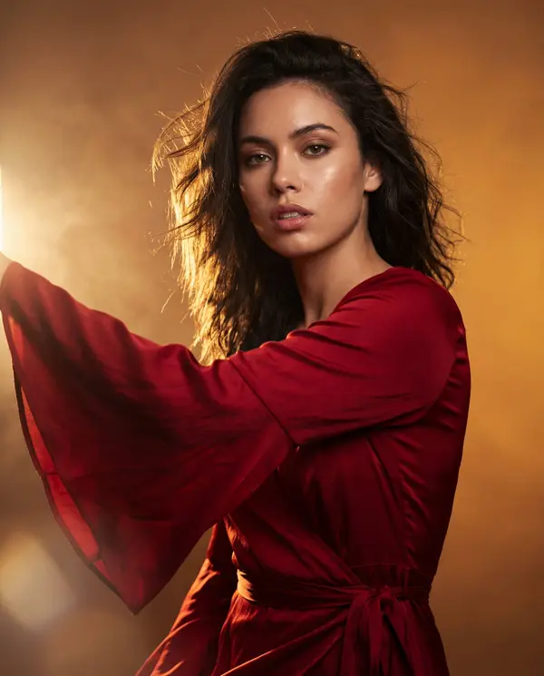 Editorial fashion portrait, woman wearing flowing red bell-sleeve wrap dress,… — GPT Image 2 prompt by @meng_dagg695
