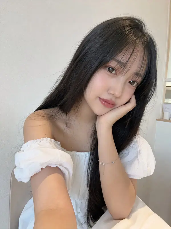 Beautiful young Japanese girl with long silky black hair, soft face-framing… — GPT Image 2 prompt by @saniaspeaks_