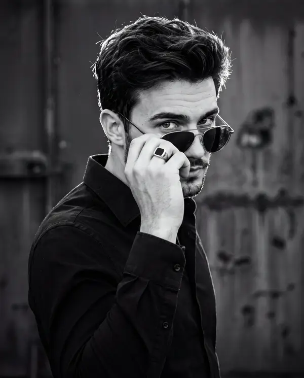 A cinematic high-contrast black-and-white portrait captured in a 4:5 vertical… — Nano Banana 2 prompt by @ChillaiKalan__