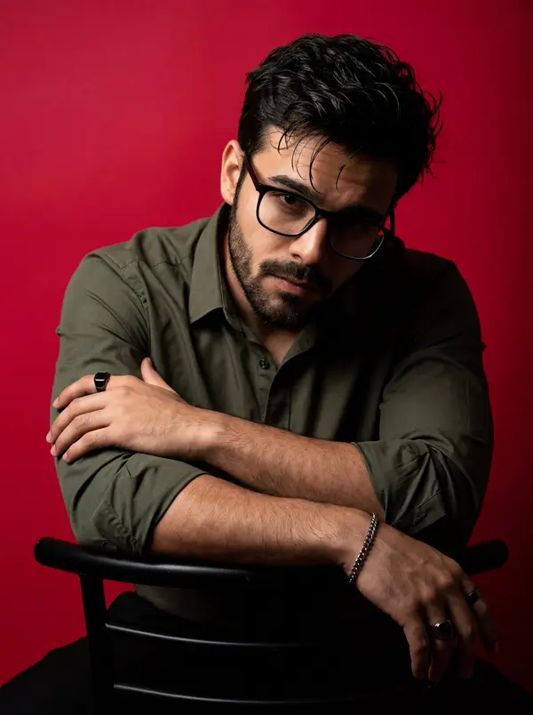 A dramatic, high-contrast studio portrait of a man with dark messy hair and a… — Nano Banana 2 prompt by @rovvmut_