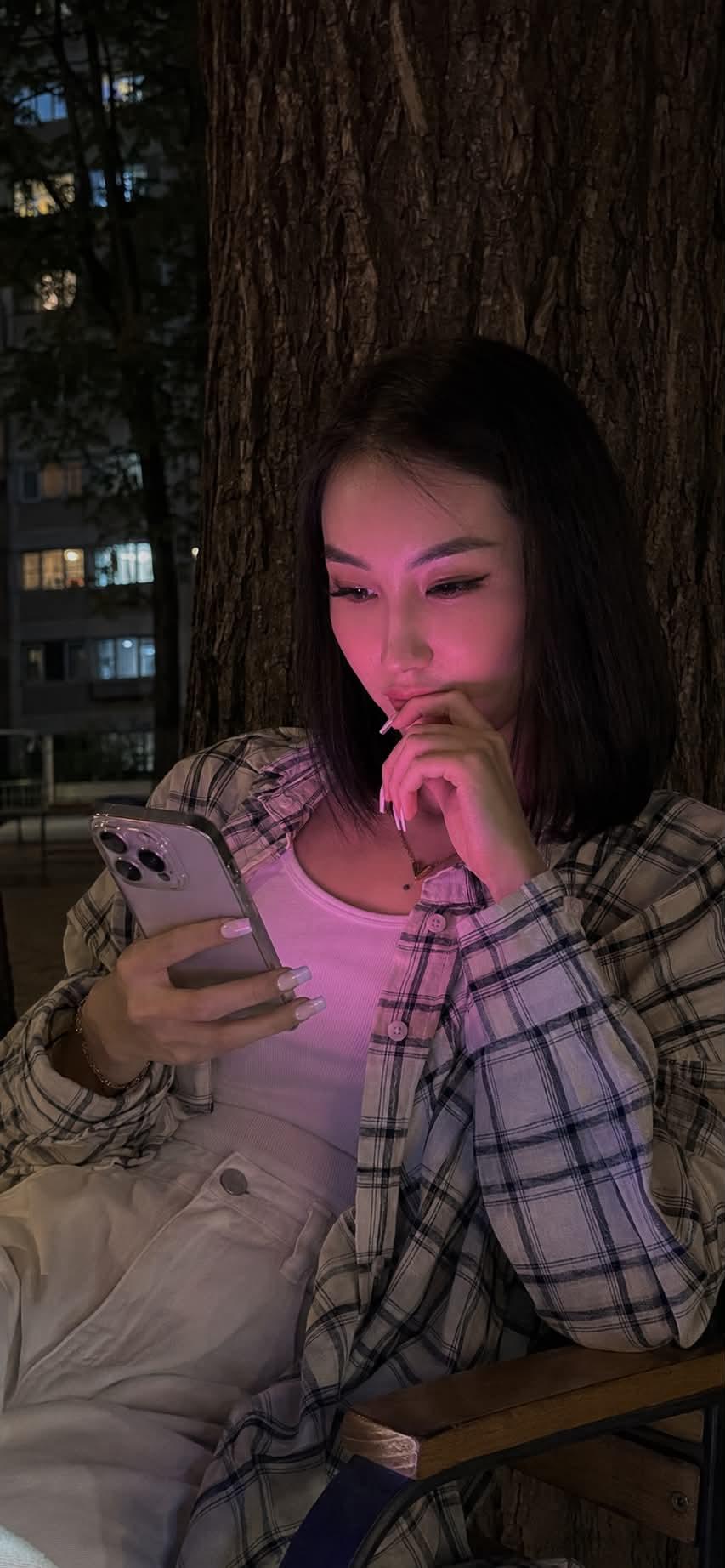 Realistic lifestyle photo shot on an iPhone 15 Pro at night. In the center of… — GPT Image 2 prompt by @oggii_0