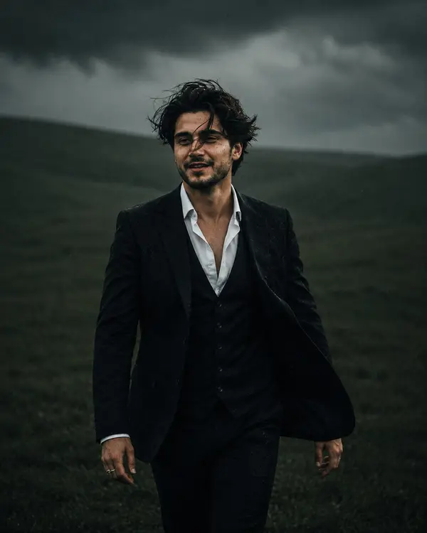 Candid fashion editorial portrait of handsome young man with medium-length dark… — GPT Image 2 prompt by @meng_dagg695