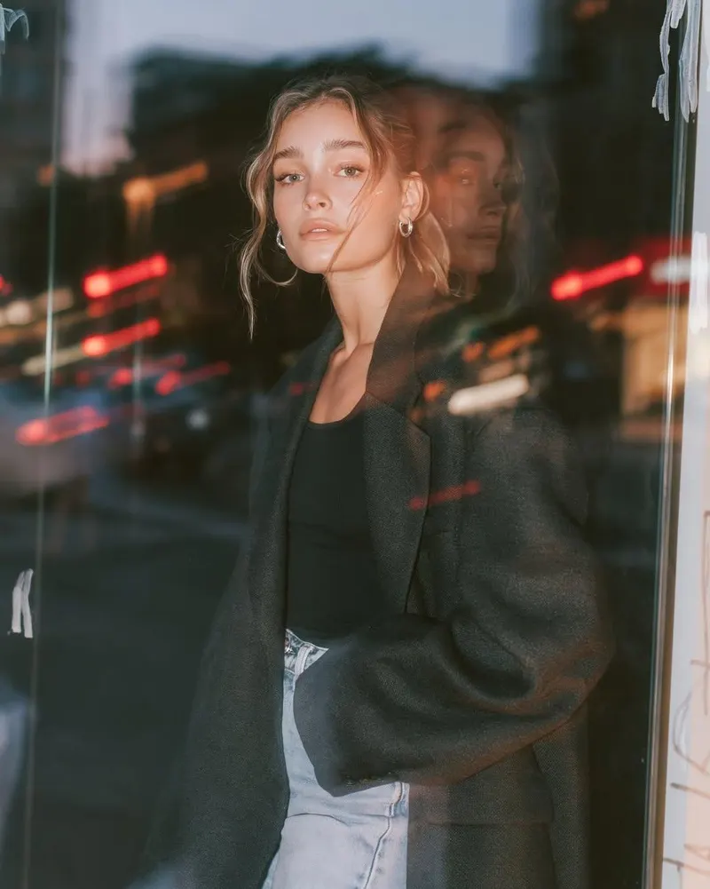 Ultra-realistic editorial fashion portrait of a young woman standing beside a… — GPT Image 2 prompt by @Taaruk_