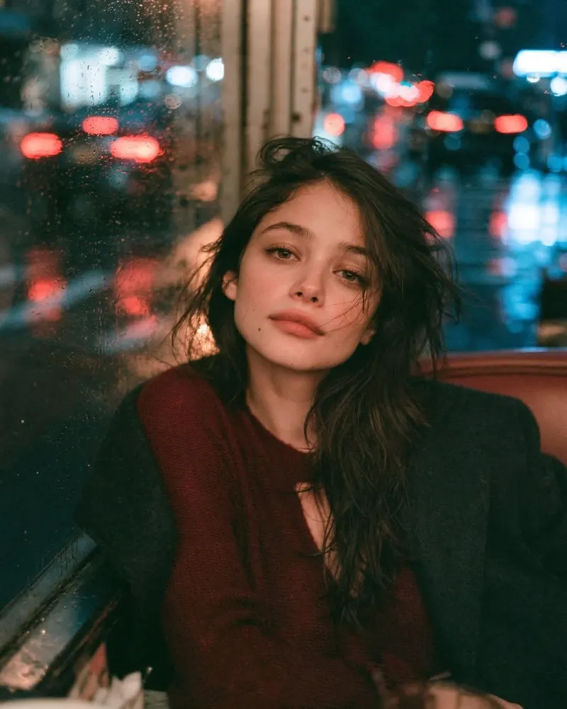 Ultra-realistic cinematic portrait of a young woman sitting alone in the corner… — GPT Image 2 prompt by @Taaruk_