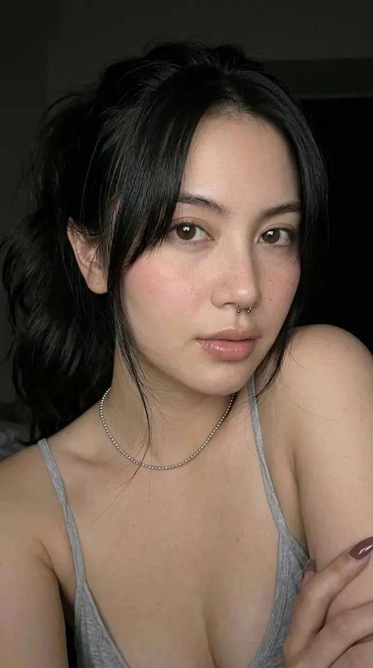 A high-end fashion studio portrait of a young woman with fair skin and dark… — GPT Image 2 prompt by @Ciri_ai