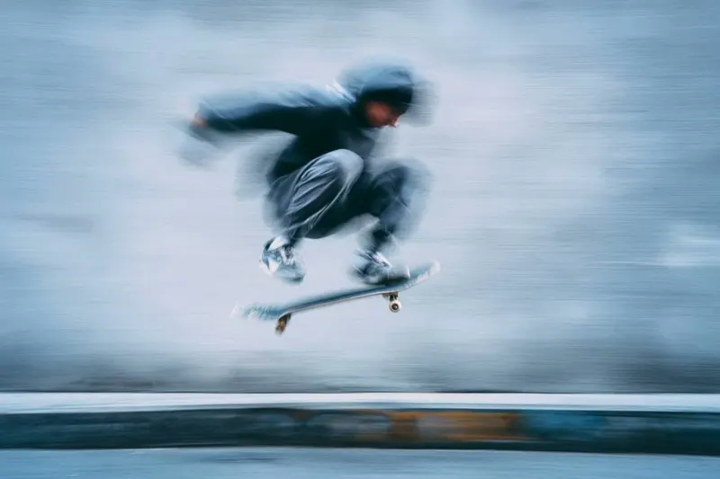 A blurred silhouette of a [subject] in motion, wearing a [color] sports kit,… — AI Model prompt by @azed_ai
