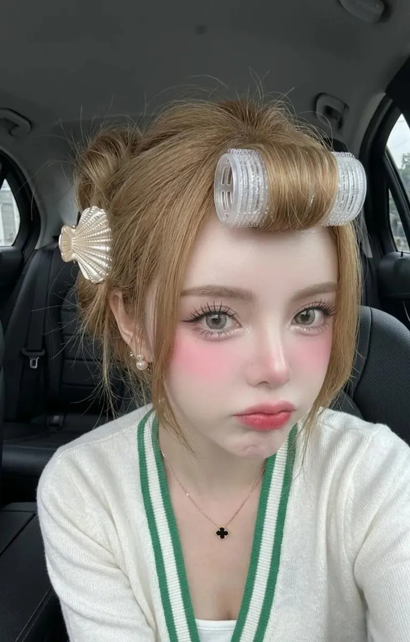 A woman is posing for a close-up selfie inside a dark, sophisticated car… — Nano Banana 2 prompt by @SimplyAnnisa